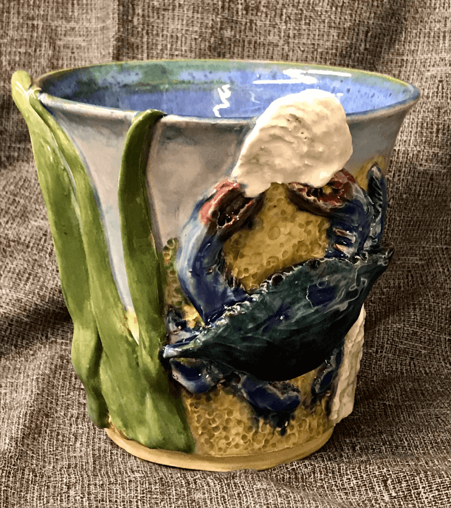 glazed pottery cup with a crab